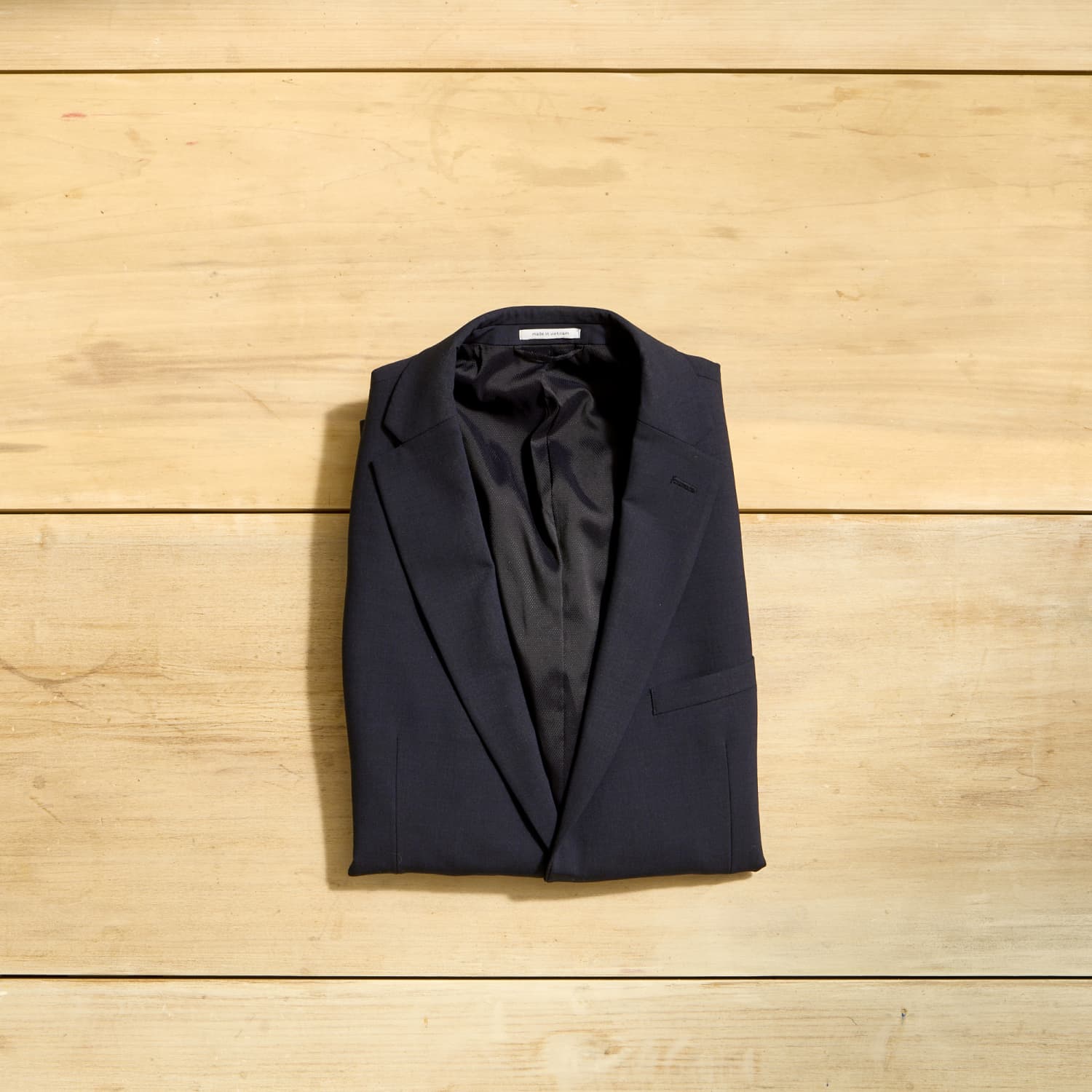 Folding a suit jacket for packing top